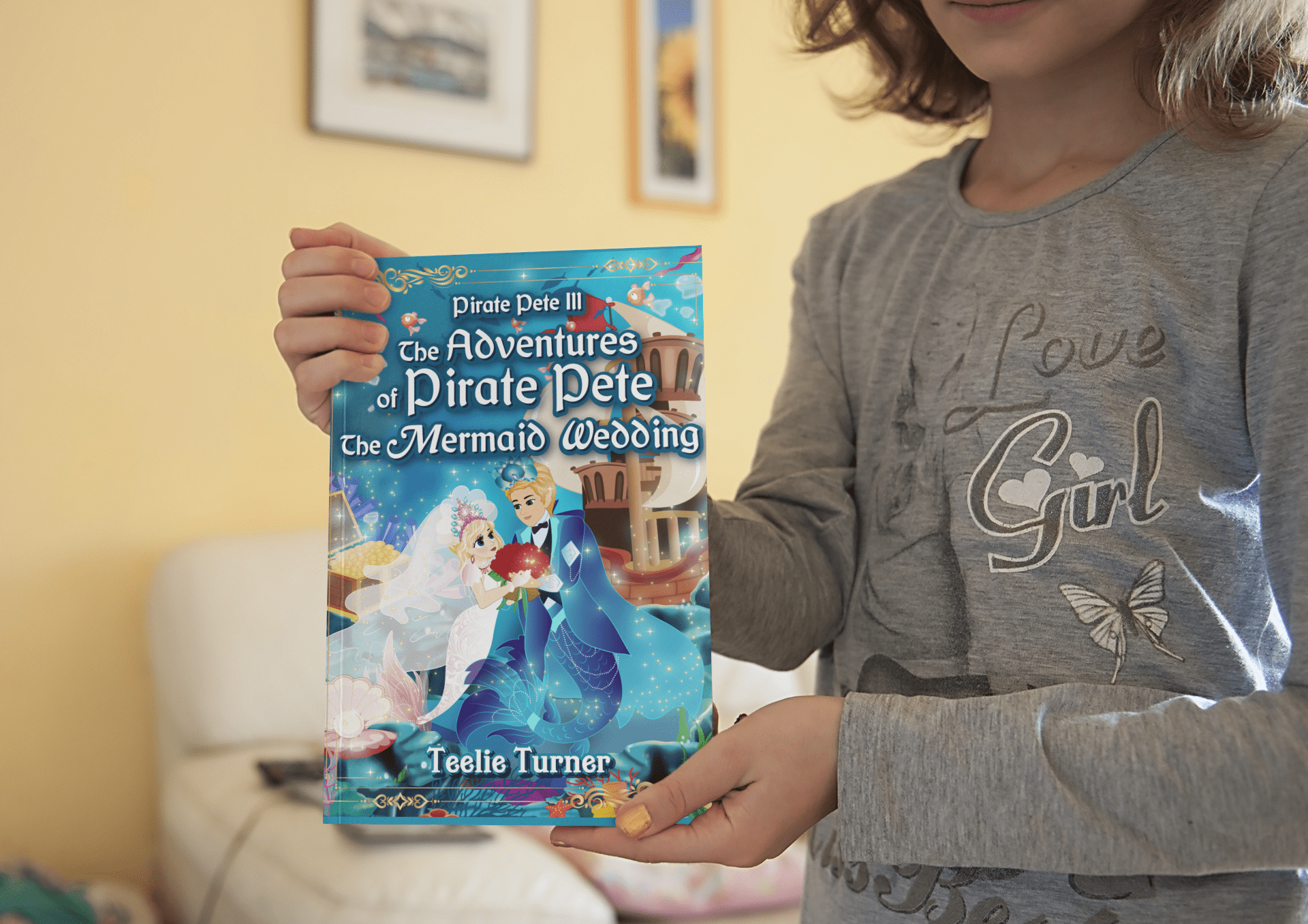 mockup-of-a-little-girl-showing-the-cover-of-a-book-3444-el1-min