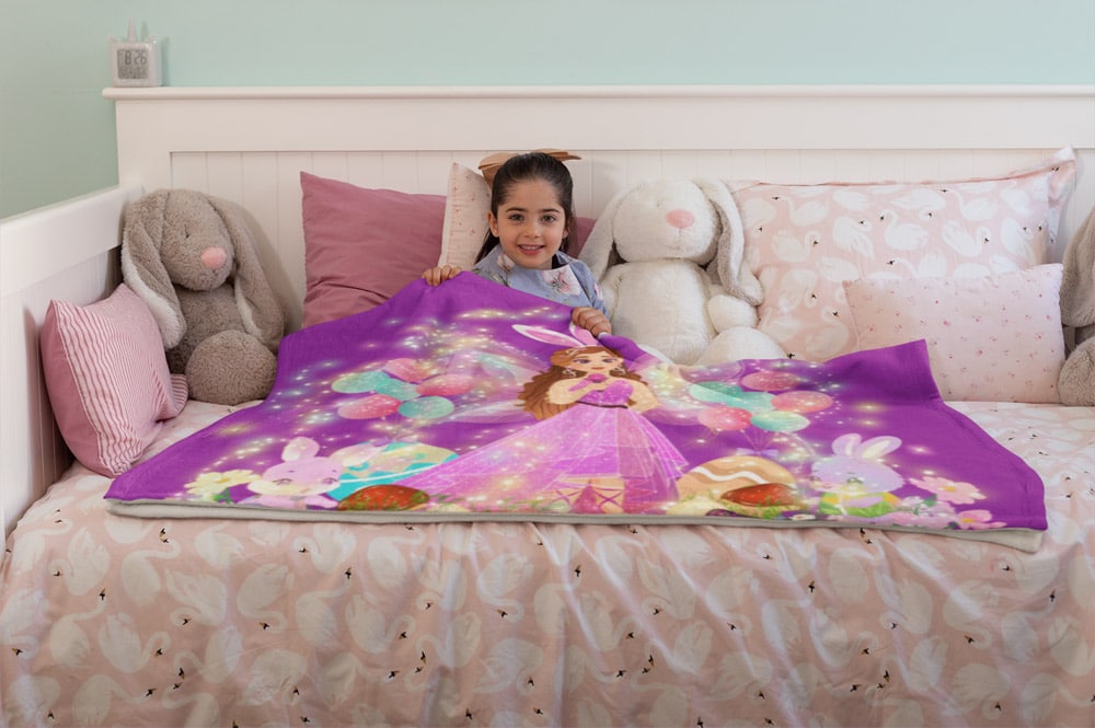 mockup-of-a-happy-little-girl-lying-under-a-throw-blanket-on-her-bed-24688