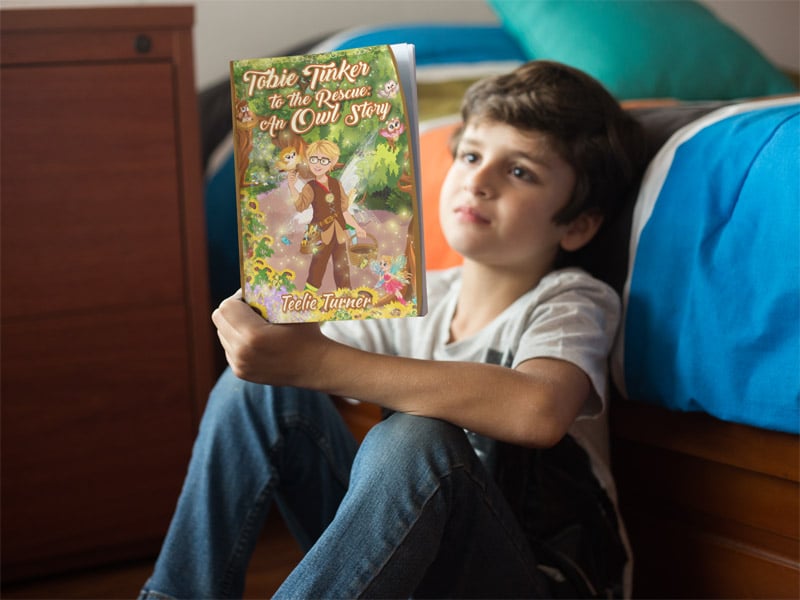 little-kid-reading-a-book-mockup-by-his-bed-a19216