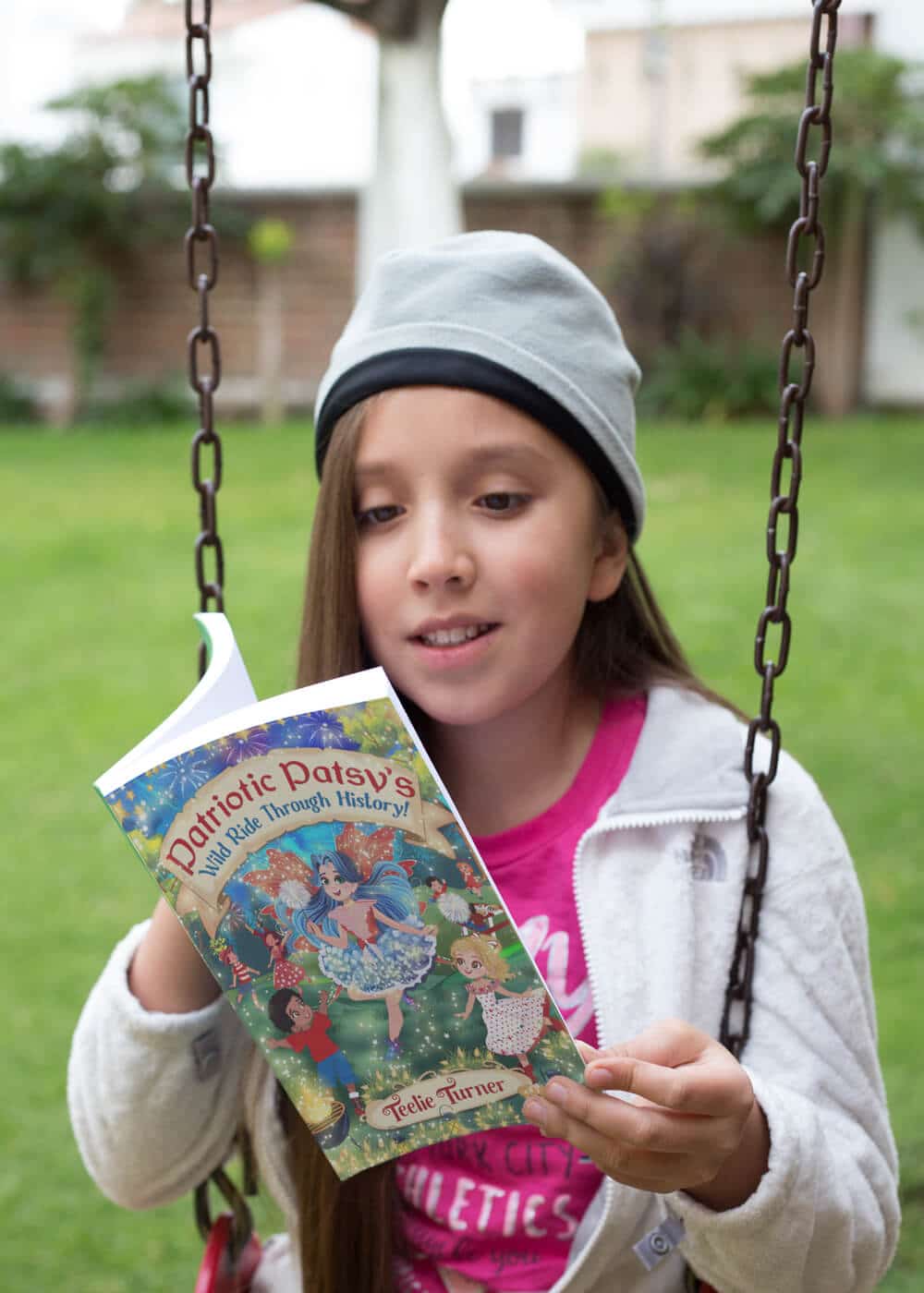 little-happy-girl-reading-her-book-mockup-on-a-swing-a19109 (2)